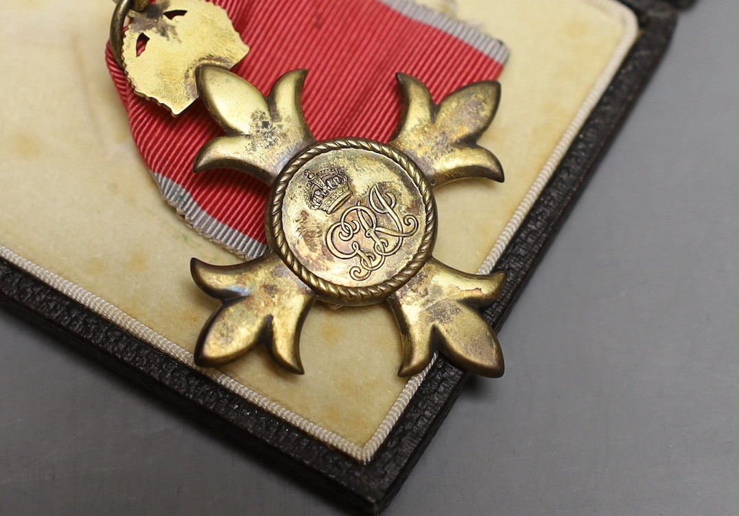 An OBE given to Edward Wilmot Morgan for his services in Hong Kong supplying mains water from Red China to Hong Kong.